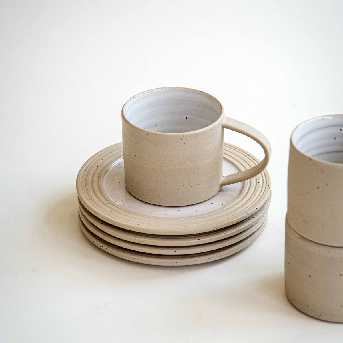 WHITE SPECKLED CUP & SAUCER